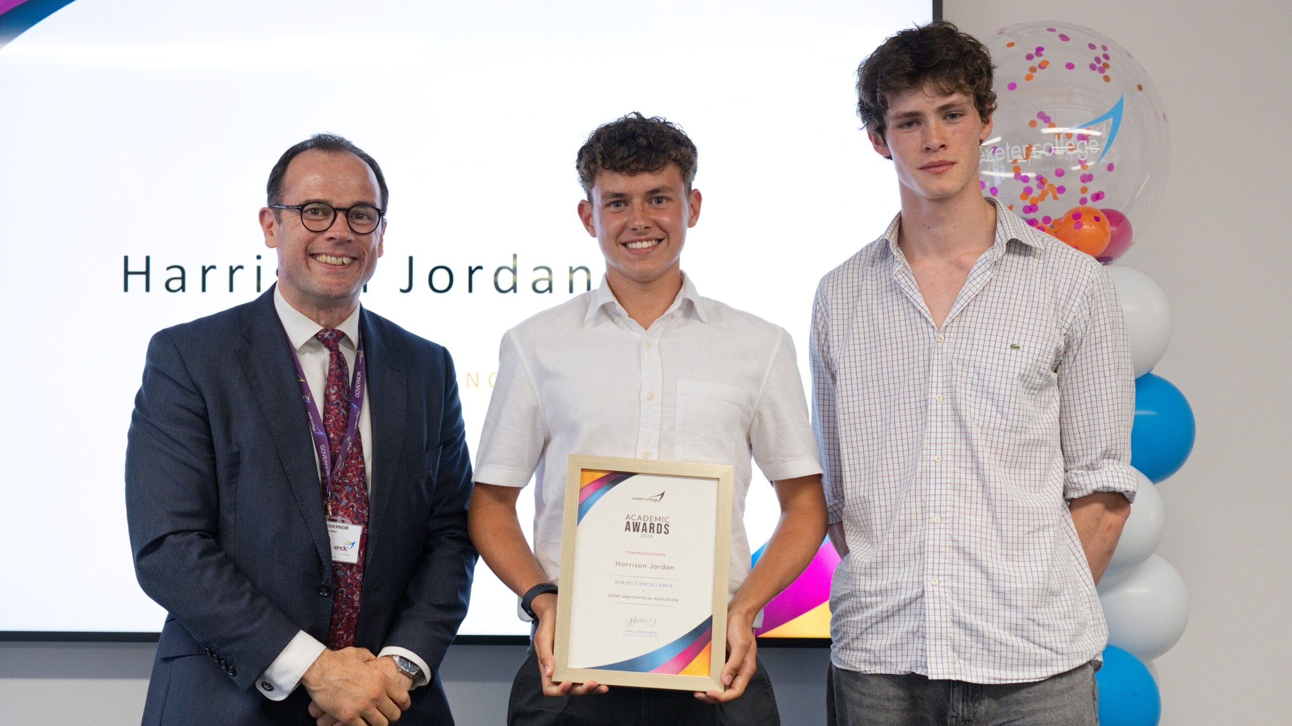Exeter College's Harrison Jordan poses with an award
