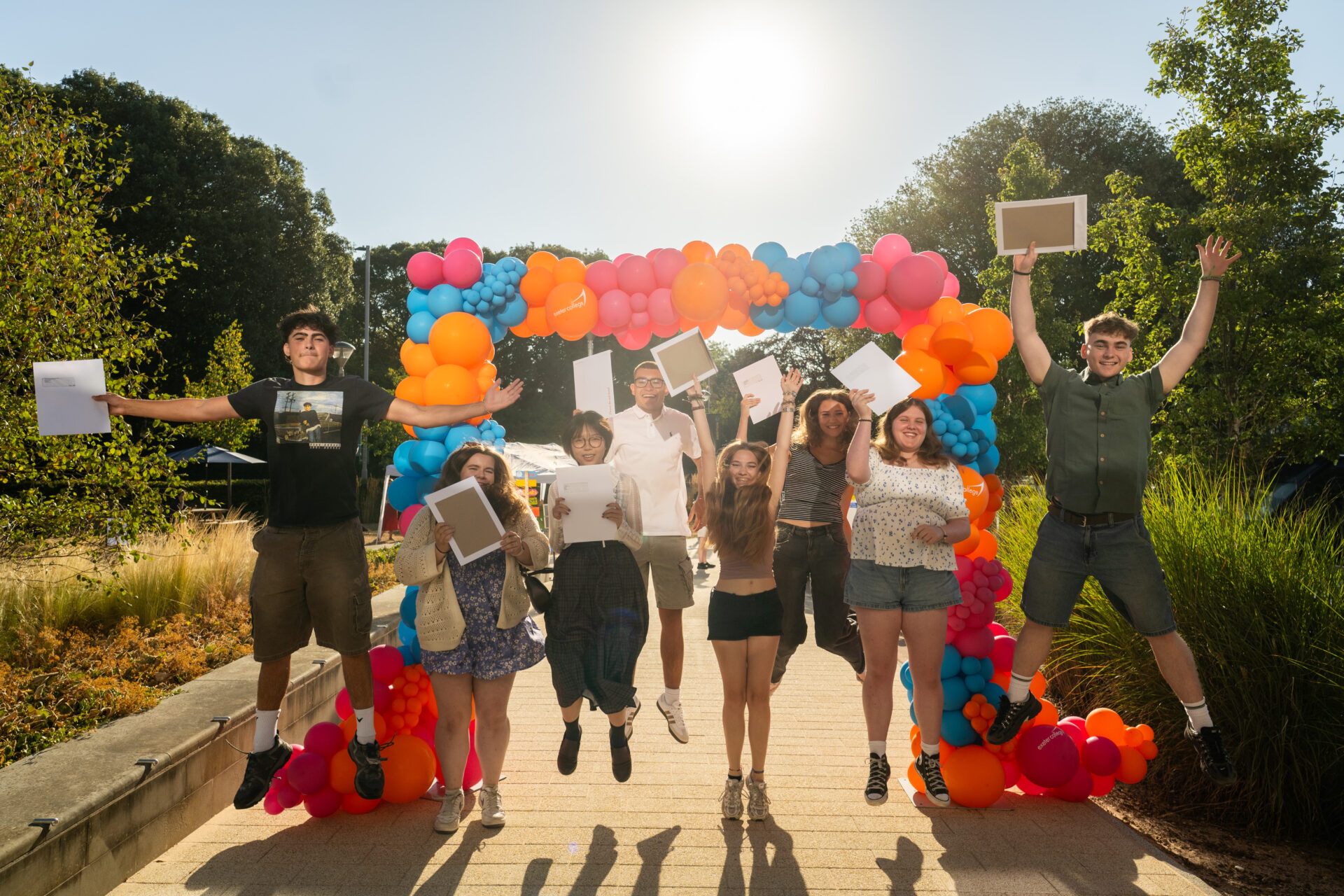 Exeter College learners jump and celebrate results
